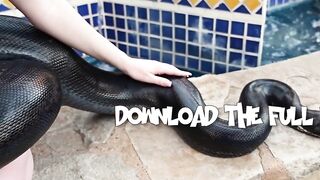 Redhead snake charmer poses nude outdoor