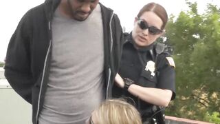 Big ass uniformed babes fuck a criminal on the rooftop