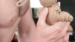 Bald guy teases himself while being controlled with a doll