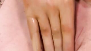 Busty masked babe in full latex suit finger fucks herself