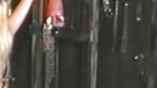 Busty blonde sub tied up for spanking in BDSM dungeon
