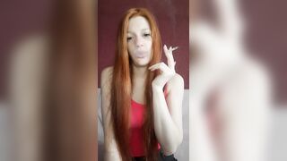 cunt with mouth with Red Hair Smokes a Cigarette