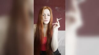 cunt with mouth with Red Hair Smokes a Cigarette