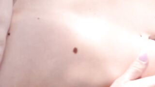 Nubile is spreading her shaved pussy while in the forest