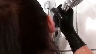 Dashing dyke teases showering in tight latex and high heels