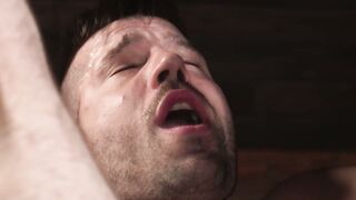 Cliff strokes Bucks cock and tugs on the chains