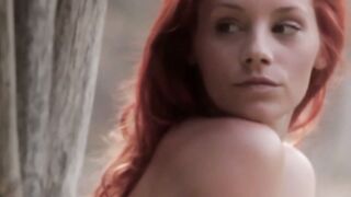 Pale redhead shows off her impeccable hips and her titties