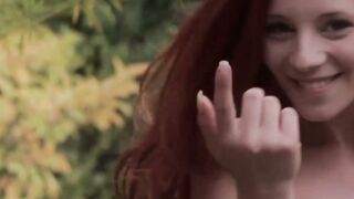 Pale redhead shows off her impeccable hips and her titties
