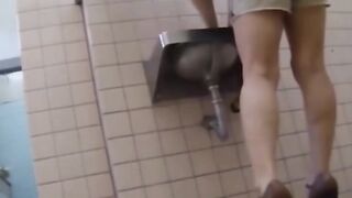 Japanese babes caught on tape while pissing in public toilet