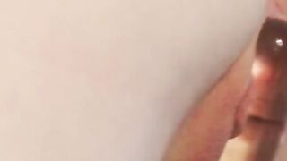 Sensual brunette Pearl lubes up her dildo with her mouth and stuffs her pussy with it