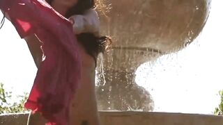 Natural babe beauty teases hard by the fountain solo