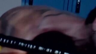 Tattooed wrestler tied up and dominated by his opponent