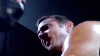 Tattooed wrestler tied up and dominated by his opponent
