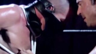 Tattooed wrestler tied up and dominated by his opponent