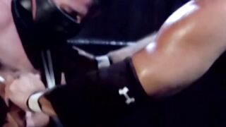 Tattooed wrestler tied up and dominated by his opponent