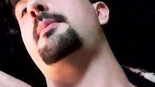 Cute young smoker works on his stiff dick and spunks