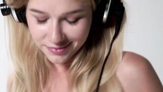 Adorable young blonde strips naked and seduces erotically