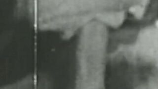 Black and white vintage video of lady sucking her lover