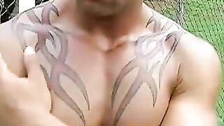 Kinky Brazilian jock masturbates on football field solo