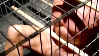 Blindfolded muscle slave dominated and teased in cage