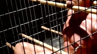 Blindfolded muscle slave dominated and teased in cage