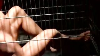 Blindfolded muscle slave dominated and teased in cage