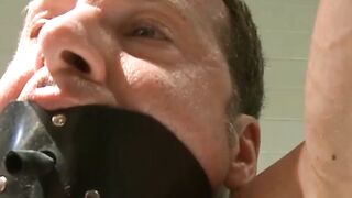 Gorgeous submissive gay tied up and doused in a warm jizz