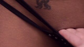 Seductress strips and then rubs her puss in the shower a bit