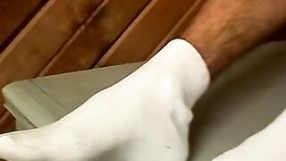 Skinny twink watches his feet and cums on them after jerking