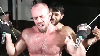 Muscle hunk tied up and tormented hard in gym basement