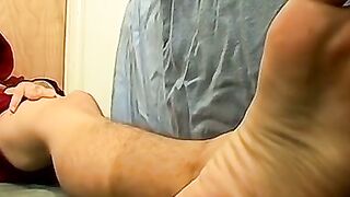 Skinny tattooed twink shows off his feet while masturbating
