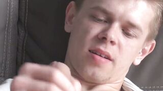 Tattooed twink Axel masturbates solo while watching porn