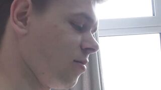 Tattooed twink Axel masturbates solo while watching porn