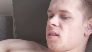 Tattooed twink Axel masturbates solo while watching porn