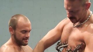 Tattooed muscle hunks torment each other with nipple clips