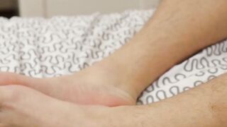 Young blond jock touches his feet while masturbating solo