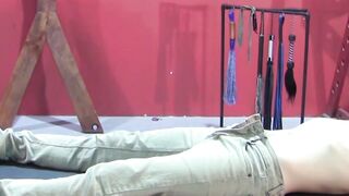 Petite slave restrained for rough BDSM tormenting session