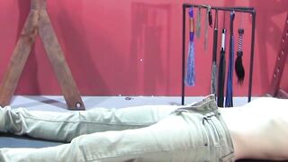 Petite slave restrained for rough BDSM tormenting session