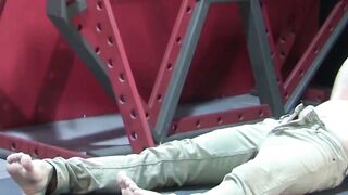 Petite slave restrained for rough BDSM tormenting session