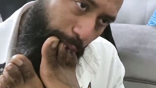 Bearded black stud licks his bosses feet while masturbating