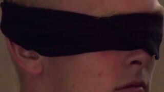 Mature master dominates a younger man and restrains his cock