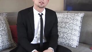 Cute man in a seductive suit Dakota Payne sniffs his socks