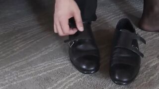 Cute man in a seductive suit Dakota Payne sniffs his socks