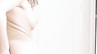 Erotic slow motion video of Davina E teasing her shaved vag