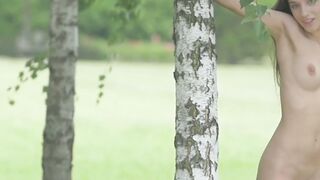 Adorable brunette Gloria Sol shows her natural tits outdoors