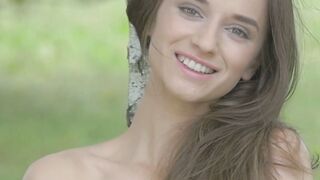 Adorable brunette Gloria Sol shows her natural tits outdoors