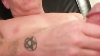 Tattooed amateur jerks off his rock hard cock before cumshot