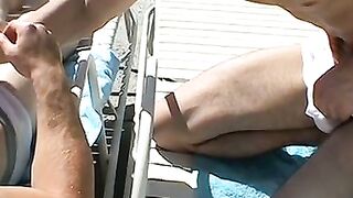 Zack Randall gives athletic Mike Roberts handjob by the pool