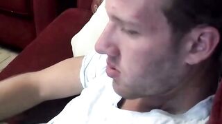 Sexy and cute Jake Parker smoking a cigar and stroking dick