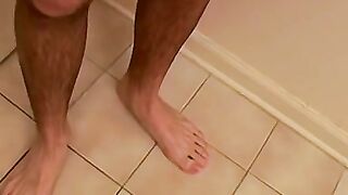 Bathroom cumshot all over this jock and his sexy feet too